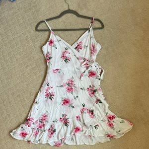 Short, pink floral wrap dress